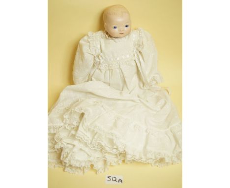 A reproduction bisque headed doll with impressed mark Grace R Putnam