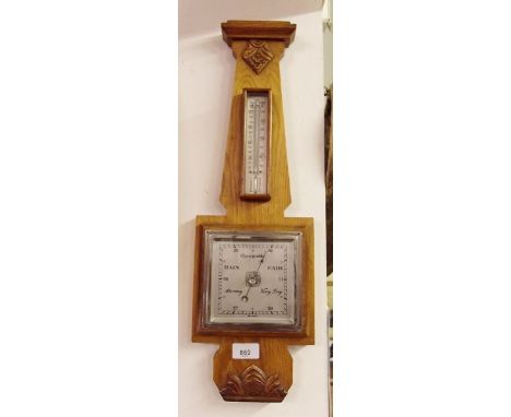 An Art Deco light oak barometer/thermometer