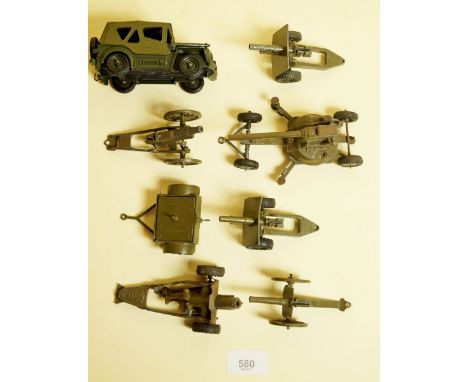 A Britains Army Jeep, a trailer and six field guns