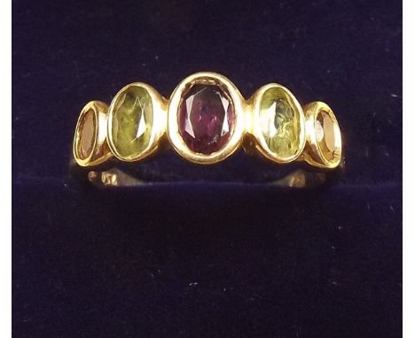 An 18 carat gold ring set peridot, citrine and amethyst, size O