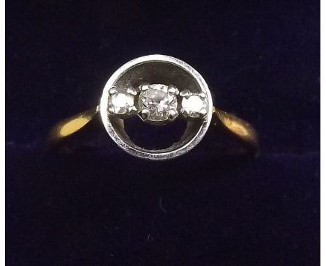 An 18 carat gold ring set three diamonds within circlet - size M