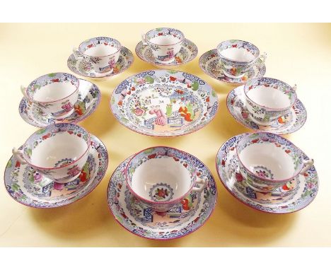 A set of eight 19th century Chinoiserie decorated tea cups and saucers and a large saucer dish