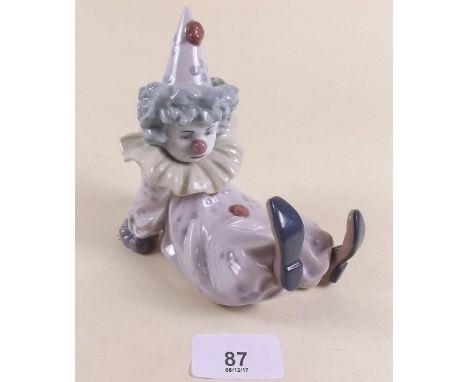A Lladro figure of a reclining clown - boxed 'Tired Friend'