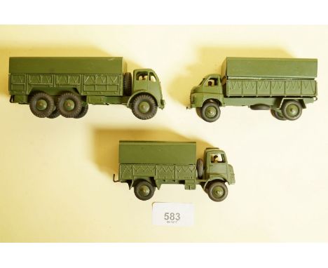 A Dinky Army wagon No 623 and two trucks No 621 and 622