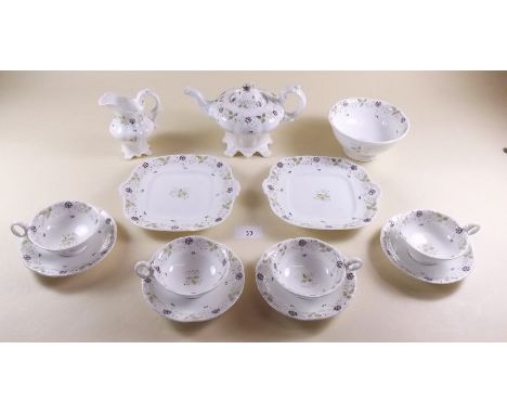 A Victorian childs tea service painted flowers comprising four cups and saucers, teapot, sugar and jug