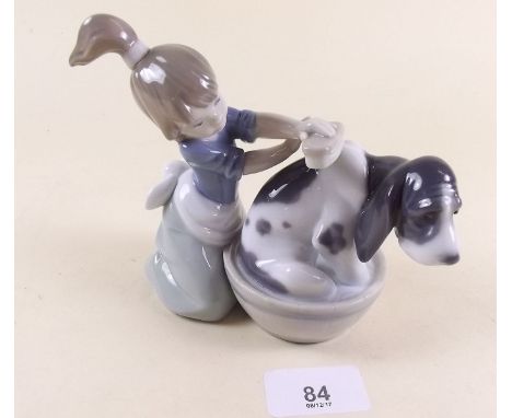 A Lladro figure of a girl and dog - boxed 'Bashful bather'