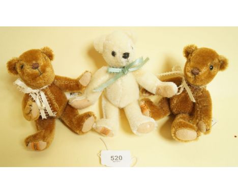 Three small Merrythought teddy bears in brown and blonde