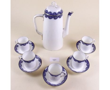 A Royal Worcester part coffee set with blue border No 7137 comprising coffee pot and five cups and saucers