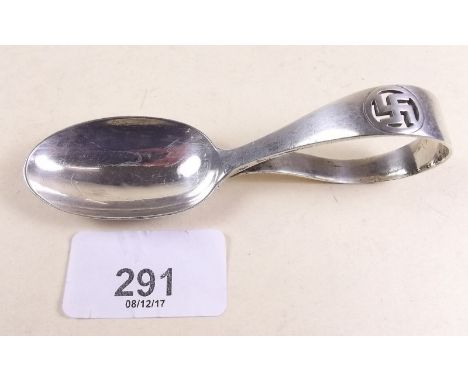 A silver Mappin and Webb caddy spoon with swastika motif - London 1916