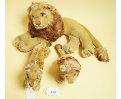 A Steiff leopard 20cm (lacking button) and a Steiff lion and cub - (lacking buttons)