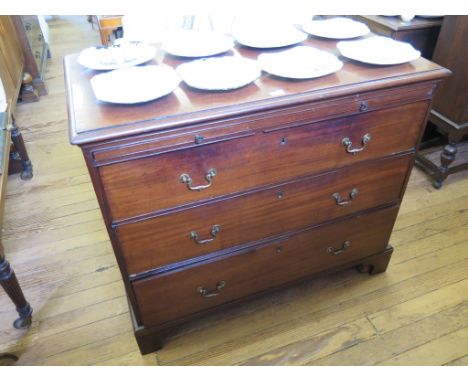 A George III mahogany chest of drawers, with brush slide over three graduated drawers on bracket feet, 108cm wide 92cm high