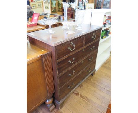 A George III mahogany chest of drawers with two short and three long graduated drawers on bracket feet, 106cm wide x 100cm hi