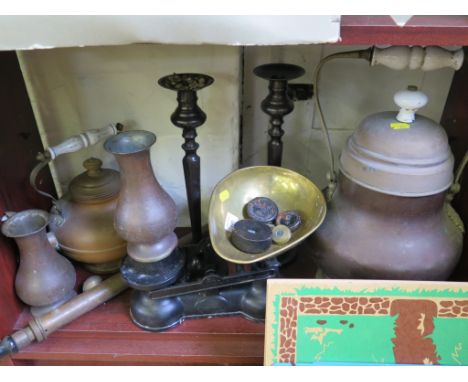 A larger copper urn, kitchen scales, pair of candlesticks and other metalwares