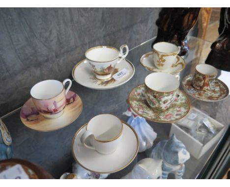 A K.P.M. Berlin foliate gilt coffee can and saucer, 6cm high, another Berlin coffee can and saucer, a Royal Worcester Harry D