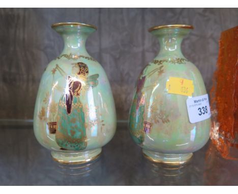 A pair of Crown Devon lustre ware vases of bulbous form with green ground each depicting a fairy and a pan-pipe player 13cm h