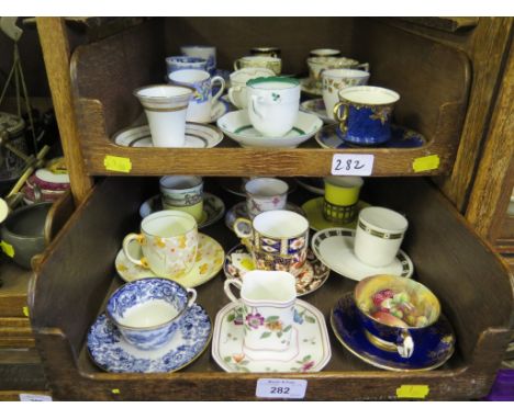 A collection of twenty-four 19th century and later coffee cans and saucers including Royal Crown Derby, Paragon, Wedgwood, Ca