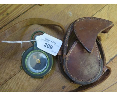 A Verner's patent brass compass by E.R. Watts & Son, with leather case and mother of pearl dial, the case dated 1917