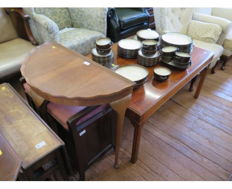 A reproduction crossbanded mahogany coffee table, the rectangular top on moulded square legs, 106cm x 76cm, a pie-crust demi-