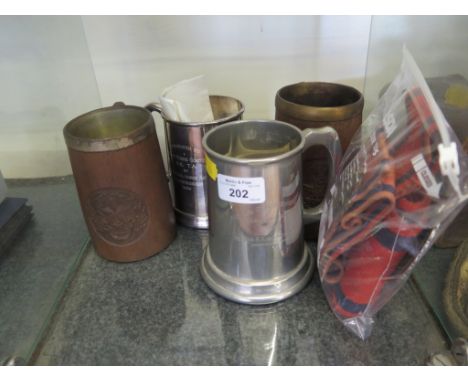A Royal Sapper and Miners Bombay badge on a Royal Engineers strap, another strap, a Royal Engineers car badge, four tankards 