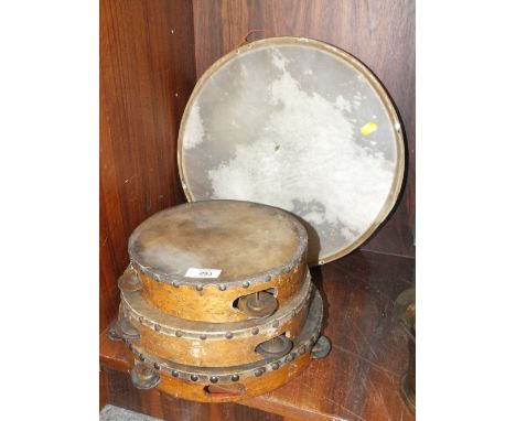 THREE VINTAGE TAMBOURINES TOGETHER WITH A DOUBLE SIDED DRUM (4) 