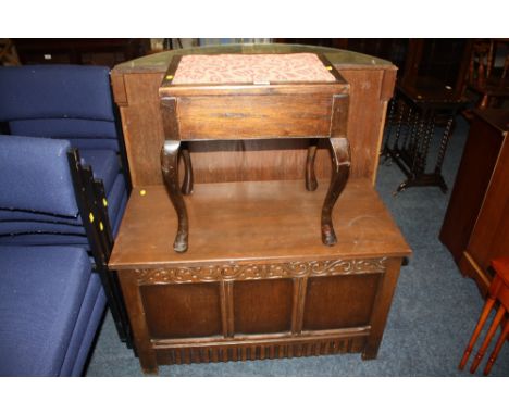 A VINTAGE CARVED OAK BLANKET BOX TOGETHER WITH AN OAK PIANO STOOL