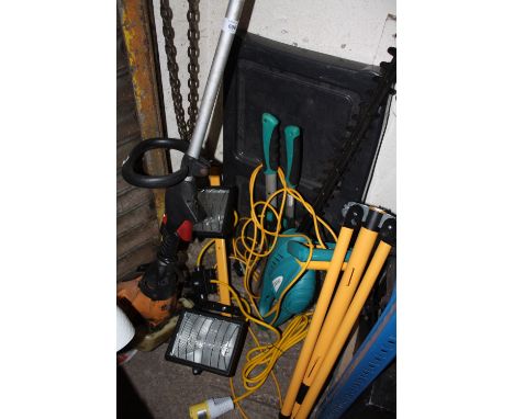 A PETROL STRIMMER, WORK LIGHT, HEDGE TRIMMER AND SHEARS