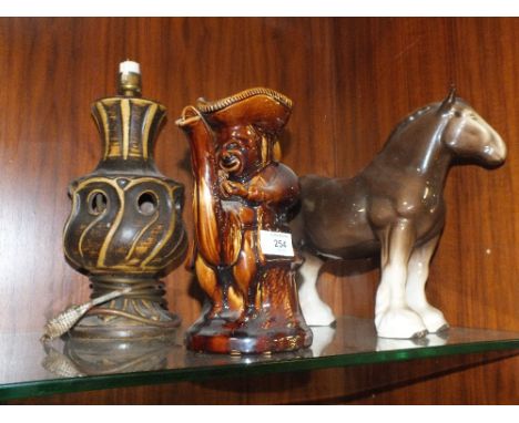 A GLAZED STONEWARE TOBY STYLE TEAPOT, TOGETHER WITH A STONEWARE LAMP AND A LARGE SHIRE HORSE FIGURE (3) 