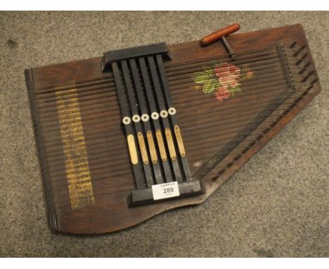 A VINTAGE SIX BAR AUTOHARP WITH INSTRUCTION BOOKLETS AND KEY 