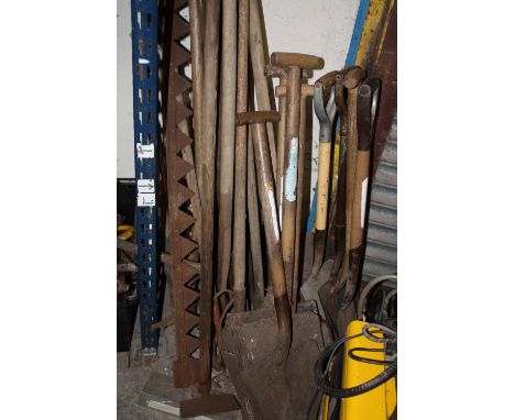 A QUANTITY OF FARMING TOOLS TO INCLUDE SHOVELS ETC