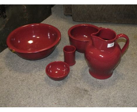 A RUBY GLAZED DENBY STONEWARE FIVE PIECE JUG AND BOWL SET