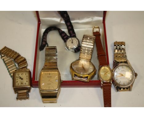 AN OMEGA WATCH BOX CONTAINING VINTAGE WRIST WATCHES