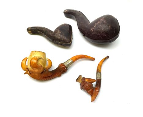 A carved meerschaum pipe depicting a lady in a tricorn hat with a silver hallmarked collar, in original case, along with a ca