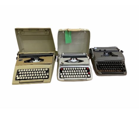 Three vintage typewriters to include Olympia, Smith-Corona Calypso and Courier, two portable with carry cases (3)