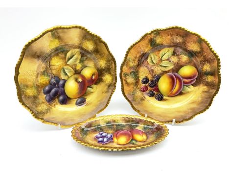 Pair of Royal Worcester hand painted plates, decorated with fruit upon a mossy ground, with gilt rims, signed J Smith, D20cm,