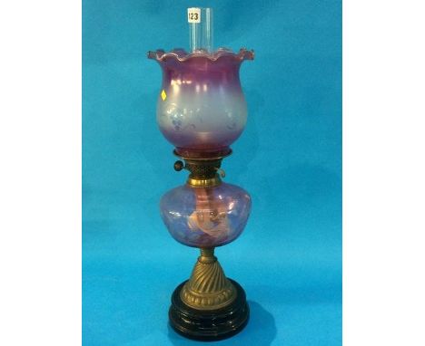 A Duplex oil lamp with pale purple reservoir and shade