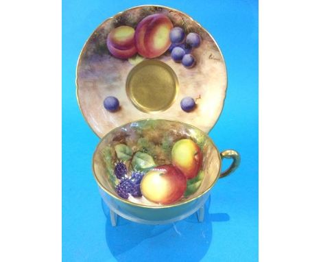A Royal Worcester cup and saucer by Maybury and Roberts, decorated with peaches, blackberries and black currants, signed, pri
