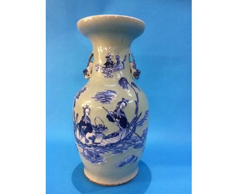 A Chinese vase on a pale sage ground decorated with figures and having lion handles.  42 cm high