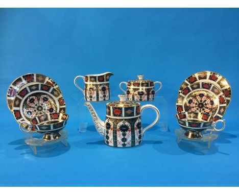 A Royal Crown Derby Imari tea service comprising; two trios, teapot, cream jug and sugar bowl (9)