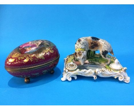 A Continental porcelain 'Abundantia' egg box with gilt metal mounts and ball feet, and a 19th century rococo style porcelain 
