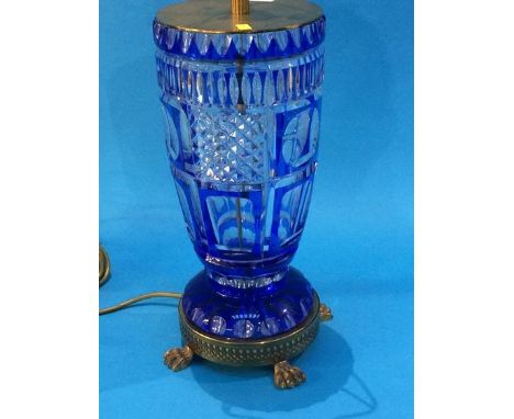 A large glass and blue flushed cut glass table lamp