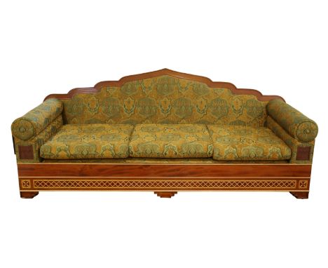 A HARDWOOD FRAMED THREE-SEATER SOFA WITH ARCHED MORESQUE BACK RAILSmodern, upholstered throughout in arabesque patterned fabr