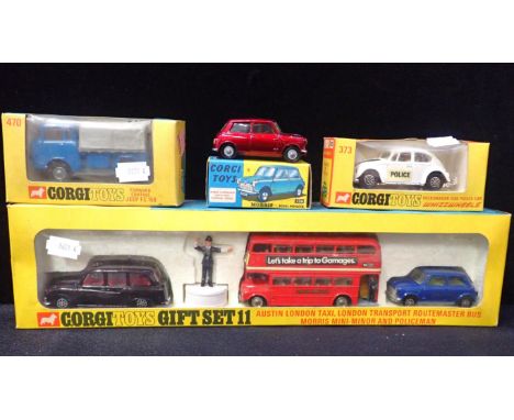 CORGI TOYS BOXEDGift Set 11 - London Taxi, Routemaster, Mini, Policeman, 470 Forward Control Jeep, 733 Police VW, 226 Mini (4
