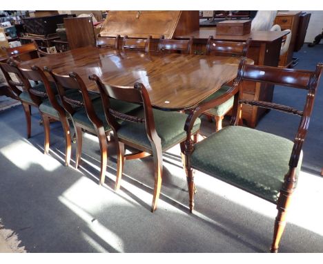 A REGENCY STYLE MAHOGANY TWIN-PILLAR DINING TABLE AND TEN CHAIRSof good quality, the table extending with two leaves to 106.5