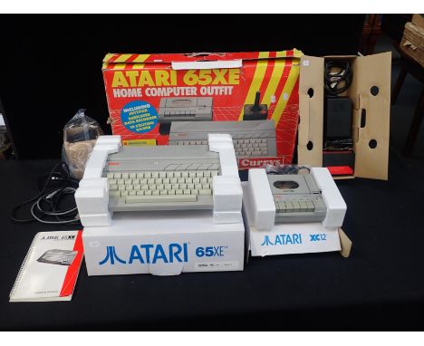 AN ATARI 65XE HOME COMPUTER OUTFITserial no.A1 & A3 060475, in original boxes and seemingly little used, with original carryi