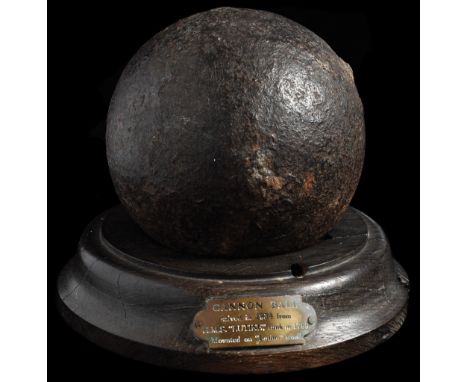 An Original Cannonball salvaged in 1934 from the wreck of the British 32-gun Frigate H.M.S. Lutine, mounted on a wooden plint