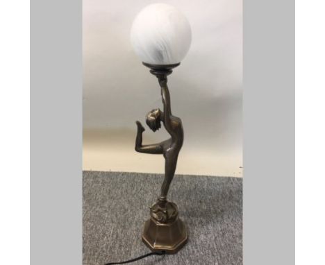 An Art Deco style figural table lamp, with a glass shade, 60cm tall