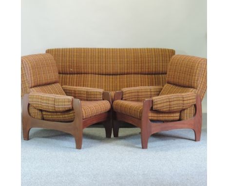 A 1970's teak and upholstered sofa, 180cm, together with a pair of matching dining chairs