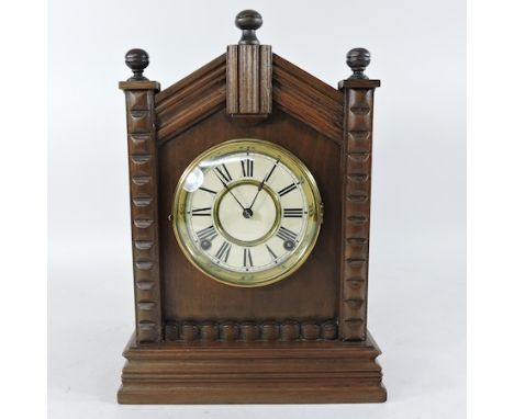An early 20th century walnut cased mantel clock, 37cm tall