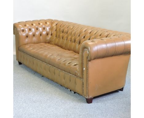 A tan upholstered button back Chesterfield sofa, 233cm