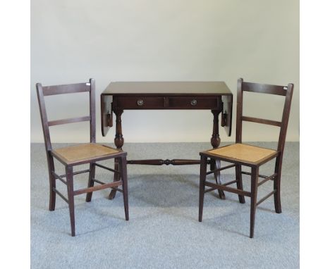 A mahogany sofa table, 142cm overall, together with two cane seated chairs 